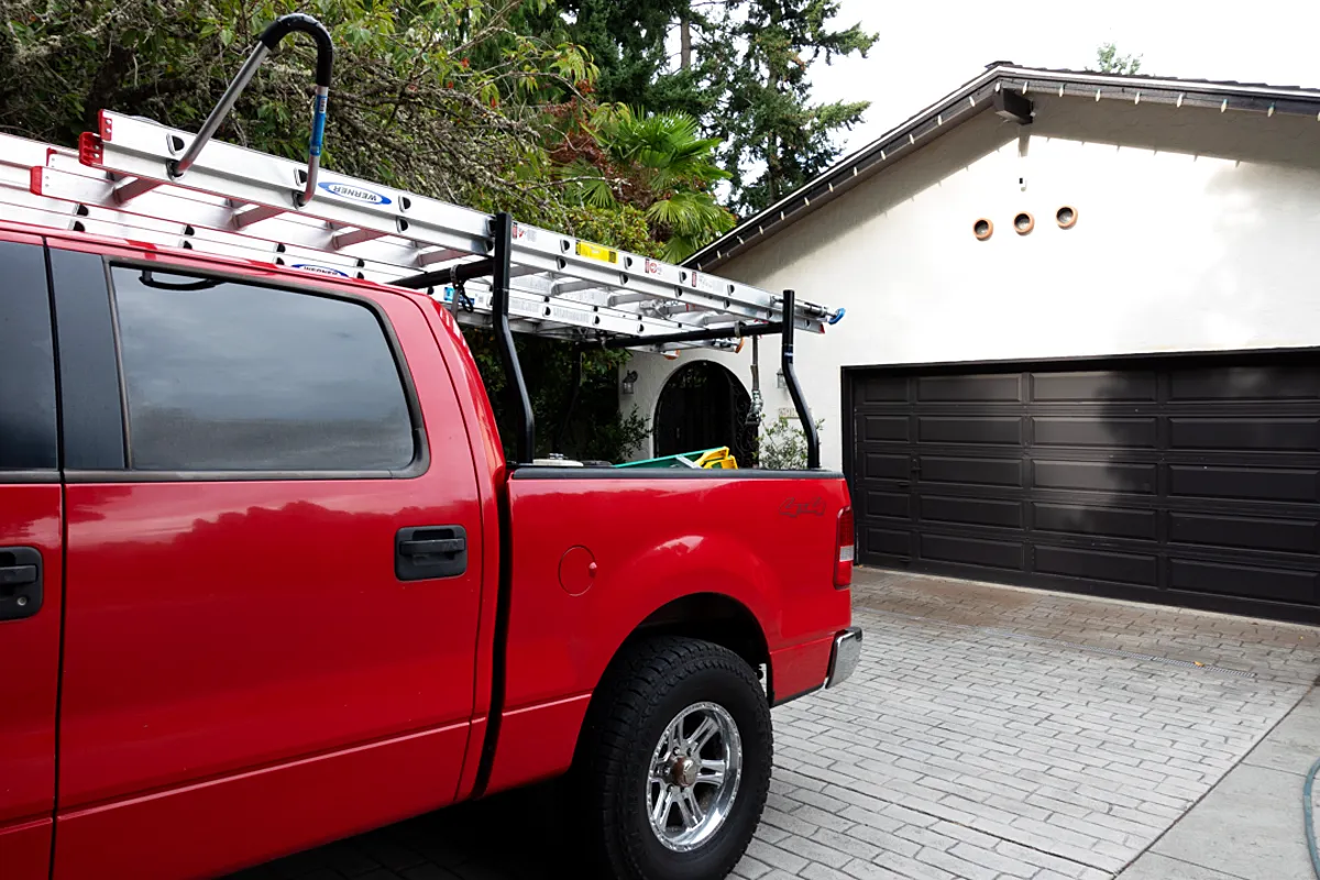 The Speaks truck with the ladder rack in a Woodinville driveway